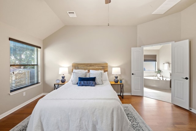 bedroom featuring lofted ceiling and wood-type flooring