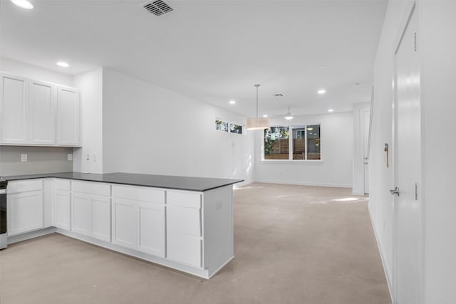 kitchen featuring hanging light fixtures, white cabinetry, decorative backsplash, and kitchen peninsula