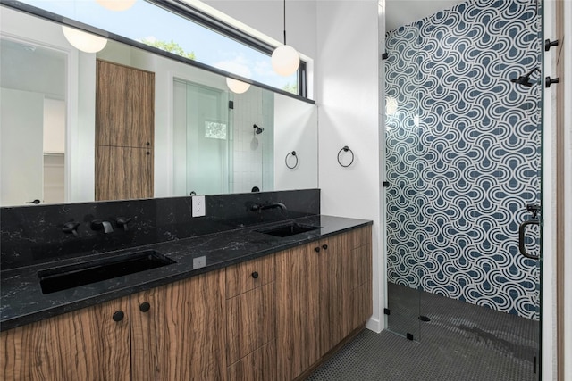 bathroom featuring walk in shower, vanity, and tile patterned floors