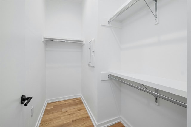 walk in closet featuring hardwood / wood-style floors