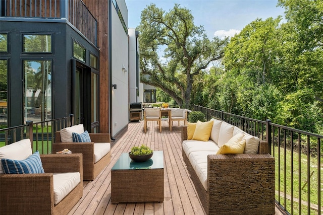 wooden deck with outdoor lounge area