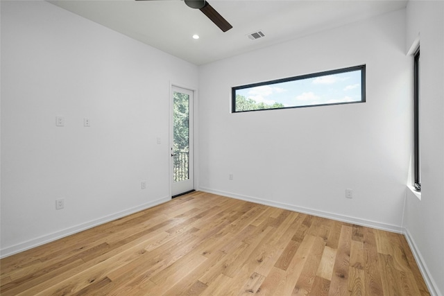 unfurnished room featuring ceiling fan and light wood-type flooring