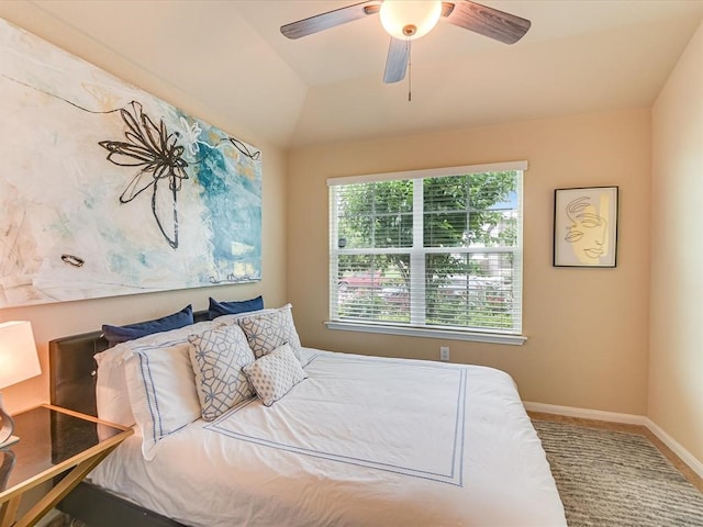 bedroom featuring lofted ceiling and ceiling fan