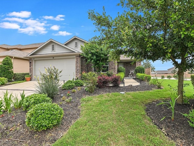 view of front of property featuring a front lawn and a garage