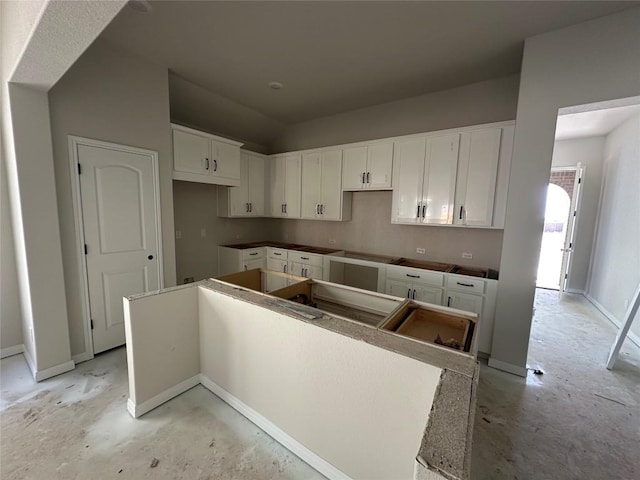 kitchen with white cabinets and a center island