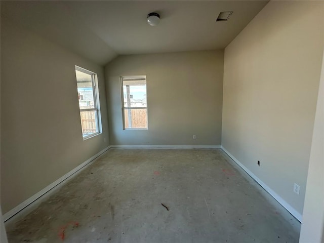 empty room with lofted ceiling