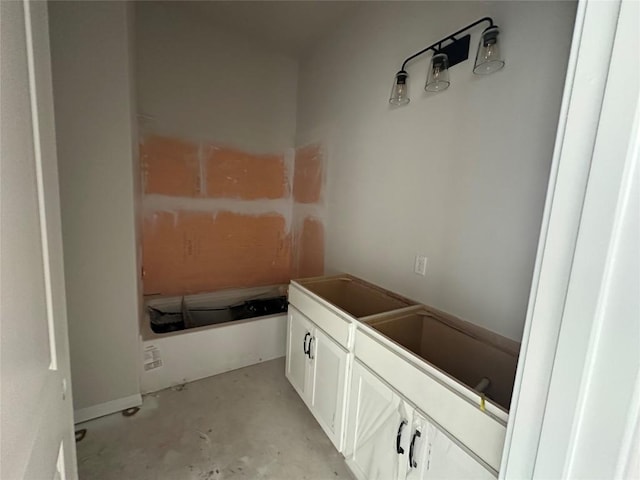 bathroom featuring concrete floors