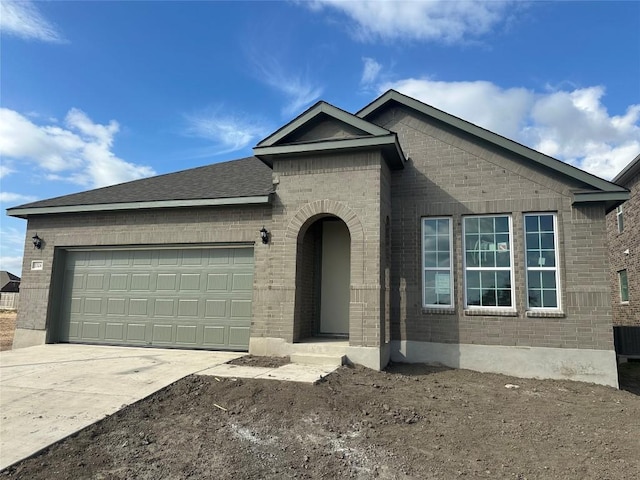 ranch-style house featuring a garage