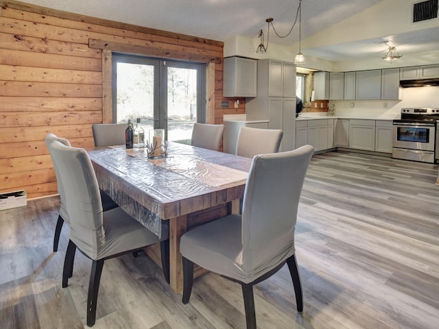 325 Simpson Ave, Cedar Creek, TX 78612 - dining area with healthy amount of natural light, light wood finished floors, and french doors