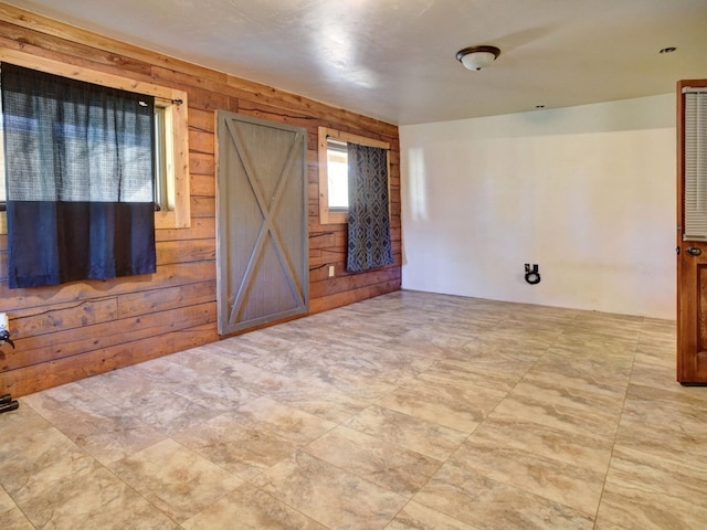 325 Simpson Ave, Cedar Creek, TX 78612 - empty room with wood walls