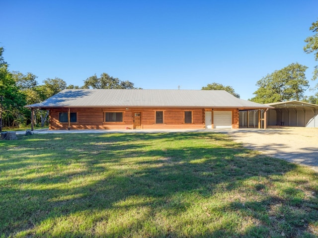 view of front of home with a front yard, a carport, and covered porch