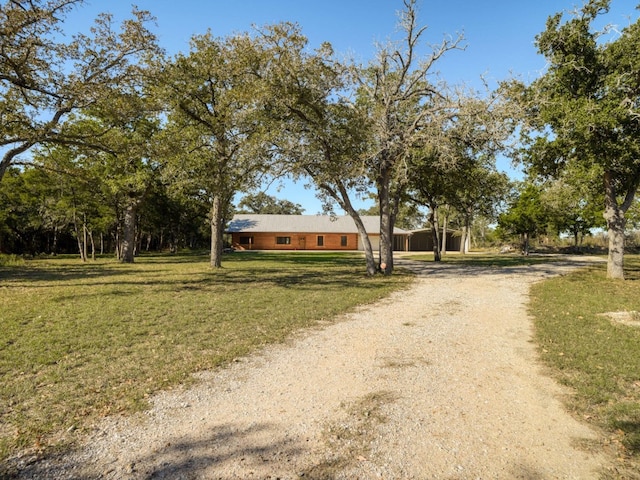 325 Simpson Ave, Cedar Creek, TX 78612 - view of front of home featuring a front lawn and driveway