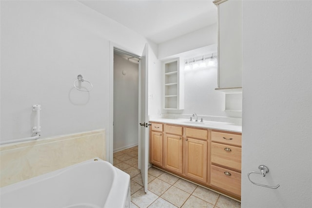 bathroom with vanity, tile patterned floors, and a bathtub