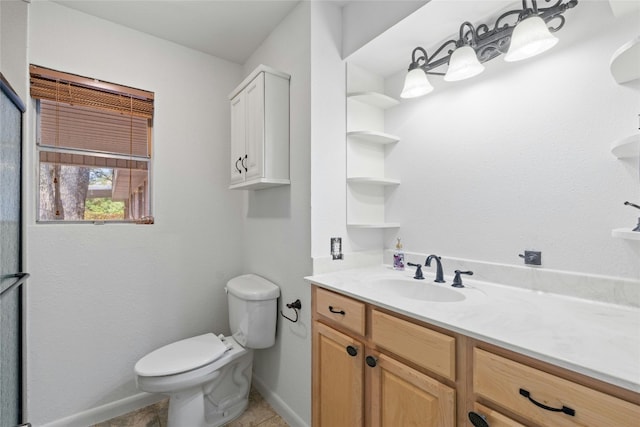 bathroom with vanity, tile patterned floors, and toilet