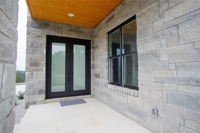 property entrance with french doors and a patio