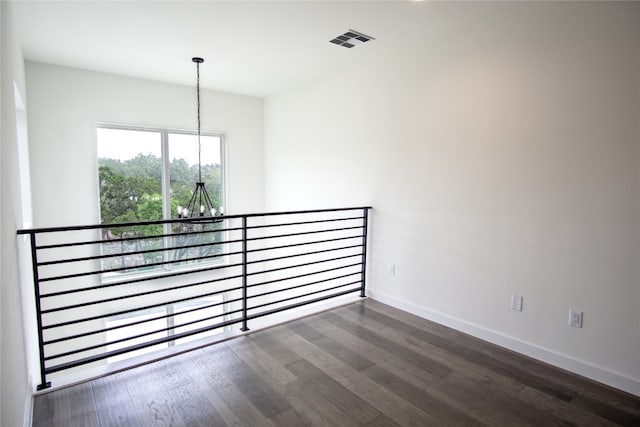 spare room with dark hardwood / wood-style flooring