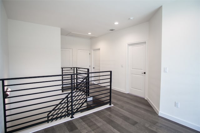 staircase featuring wood-type flooring