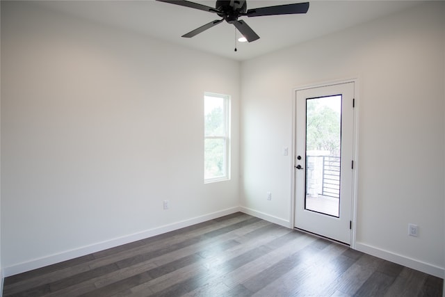 interior space featuring ceiling fan and dark hardwood / wood-style floors