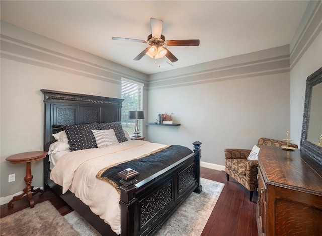 bedroom with dark wood-type flooring and ceiling fan