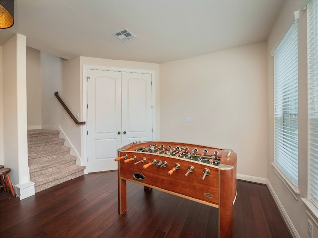 game room featuring dark wood-type flooring