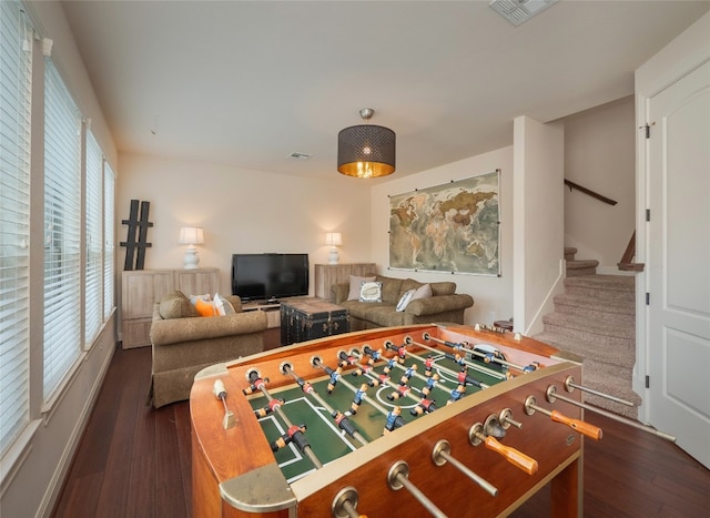 playroom featuring a wealth of natural light and dark hardwood / wood-style floors