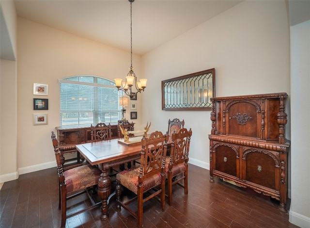 dining space featuring a notable chandelier and dark hardwood / wood-style floors