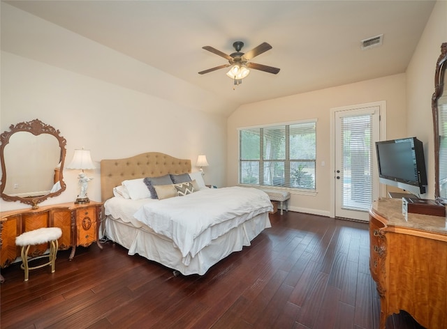 bedroom featuring access to exterior, ceiling fan, dark hardwood / wood-style floors, and vaulted ceiling