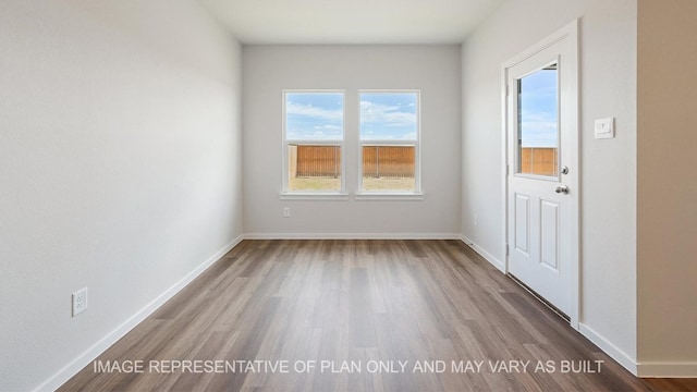 spare room featuring hardwood / wood-style flooring