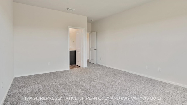 spare room featuring carpet flooring