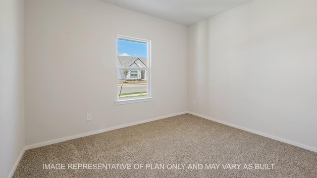 spare room featuring carpet