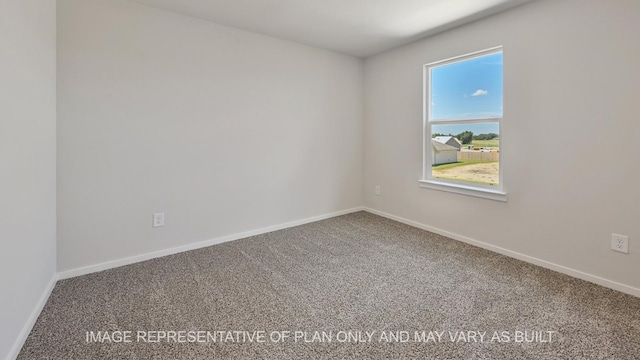 unfurnished room with carpet flooring