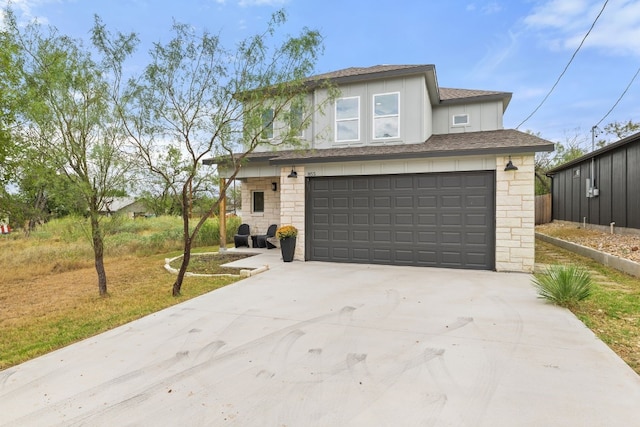 view of front facade with a garage and a front yard