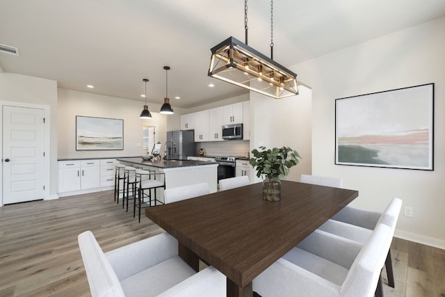 dining area with light hardwood / wood-style flooring