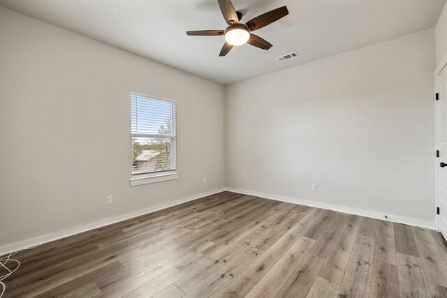 unfurnished room featuring ceiling fan and light wood-type flooring