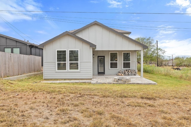 view of front facade with a patio and a front yard