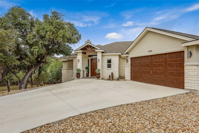 single story home featuring a garage