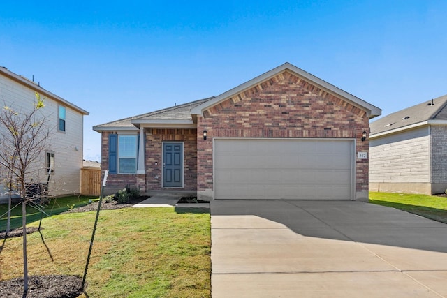 view of front of house featuring a front yard and a garage