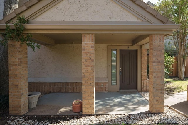 doorway to property with a patio area