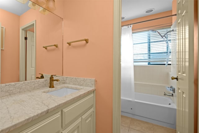 bathroom featuring tile patterned floors, shower / bathing tub combination, and vanity