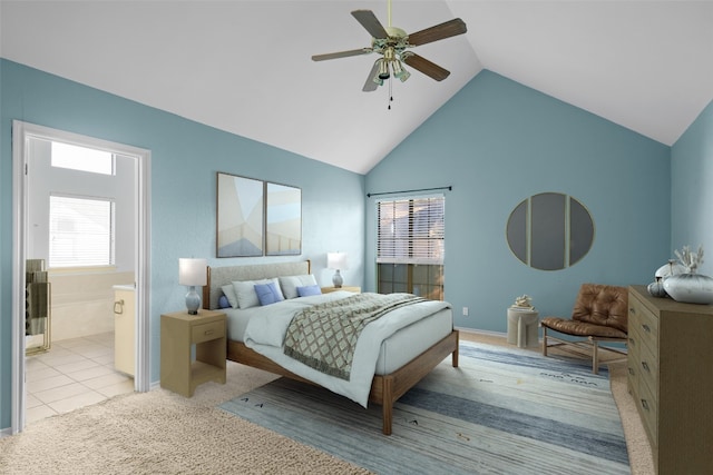 bedroom with lofted ceiling, connected bathroom, ceiling fan, and multiple windows