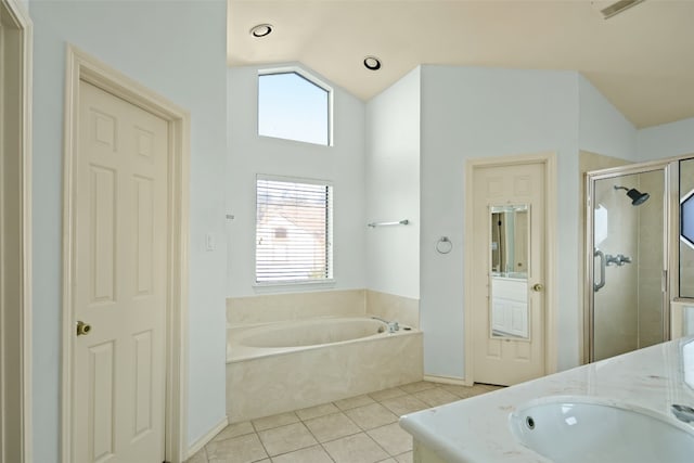 bathroom featuring plenty of natural light, vanity, independent shower and bath, and lofted ceiling