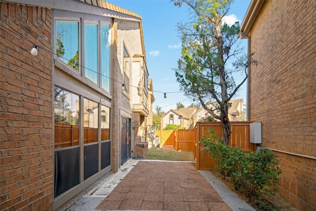 view of side of home featuring a patio area