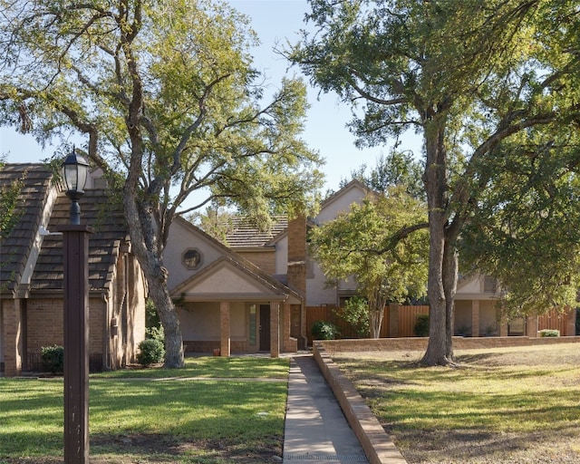 view of front of home featuring a front lawn