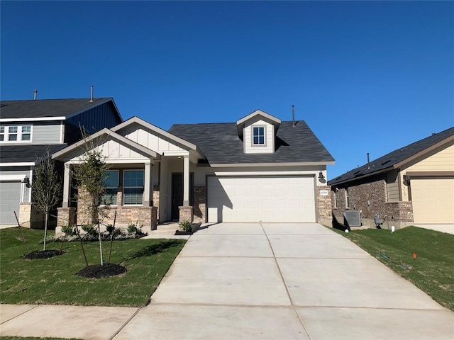 craftsman house with central AC and a front lawn