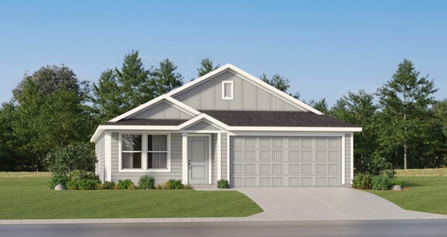 view of front of home featuring a garage and a front yard