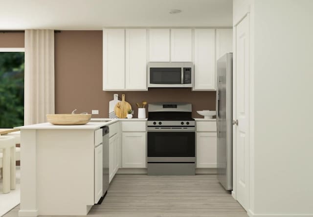 kitchen featuring light hardwood / wood-style flooring, stainless steel appliances, kitchen peninsula, and white cabinets