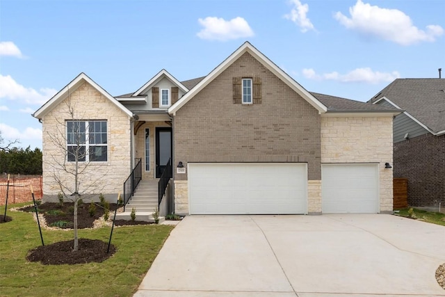 view of front of home with a garage and a front lawn