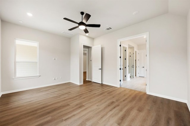 unfurnished bedroom with ceiling fan and light hardwood / wood-style flooring