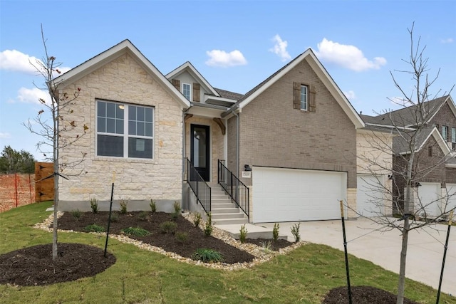 view of front of property featuring a front lawn and a garage