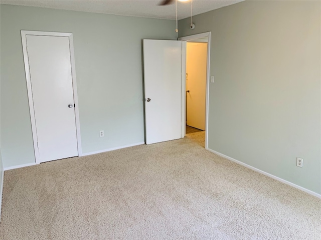 unfurnished bedroom featuring light colored carpet